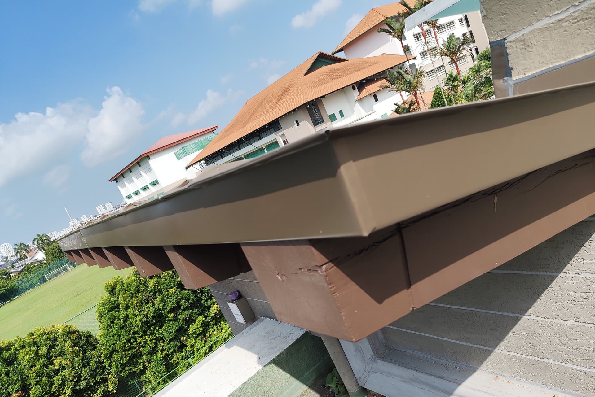 Roof edge and perimeter flashing detail at Siglap View