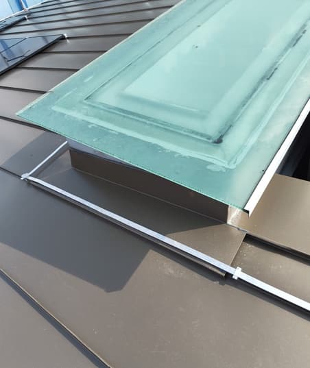 Reinforced metal flashing around the skylight opening at Siglap View