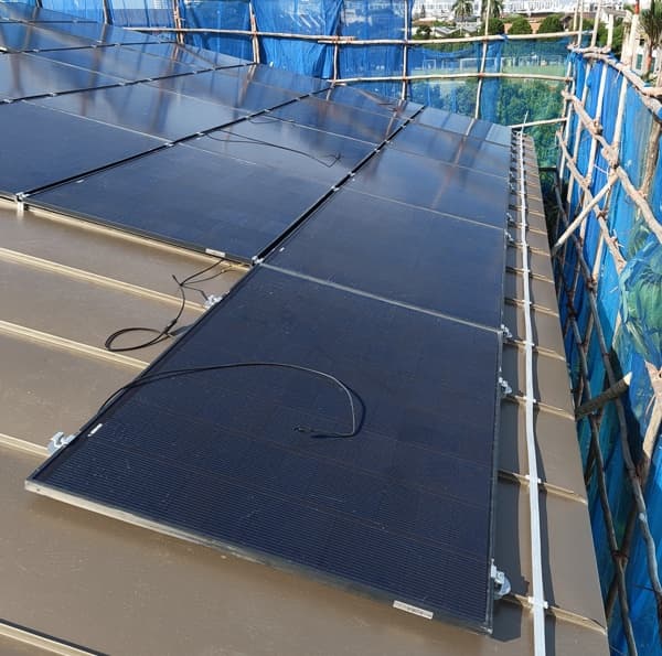 Completed standing seam roof with an integrated rooftop solar system at Siglap View