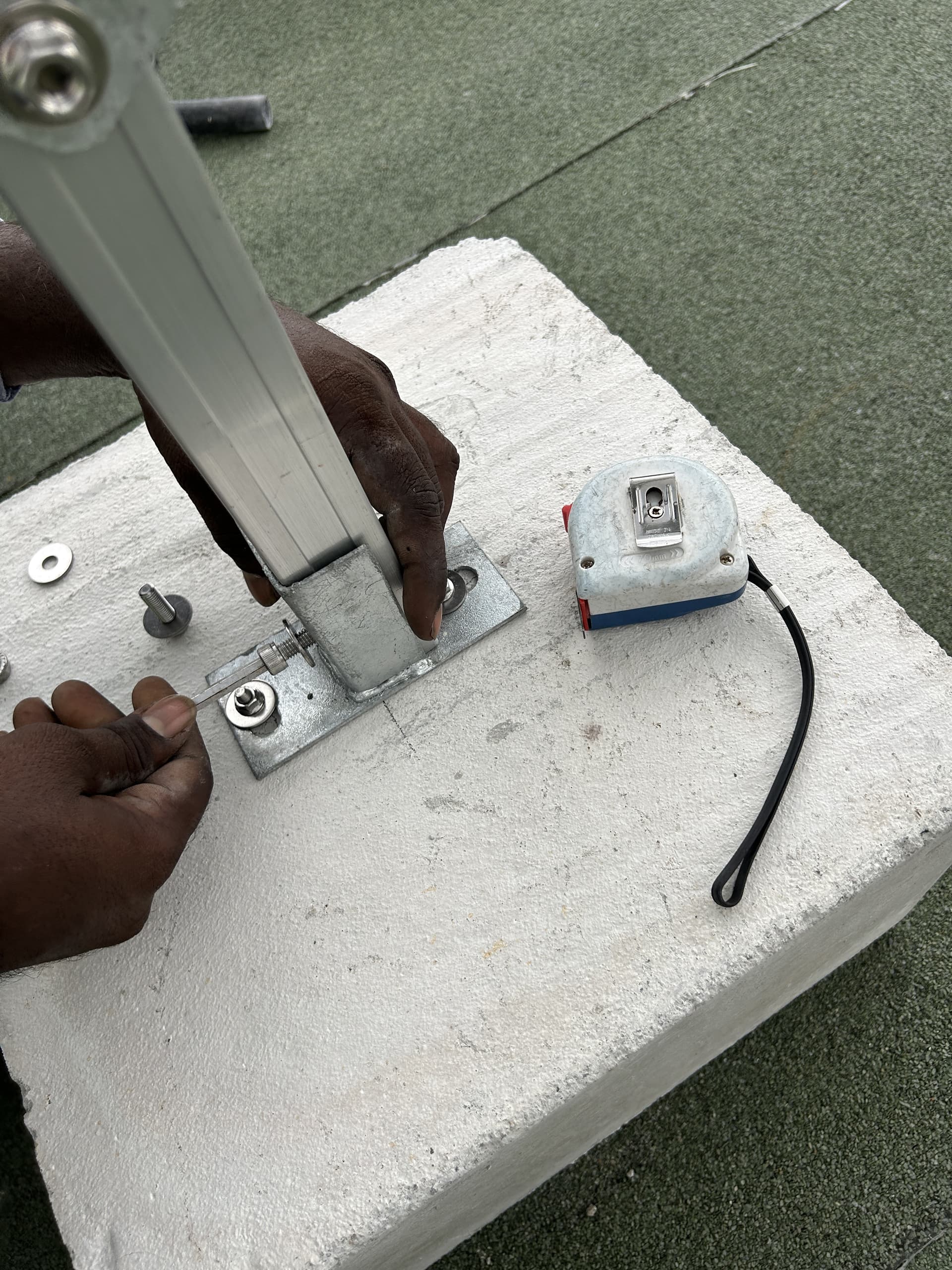 Concrete ballast block and supporting structure used for a flat roof solar installation