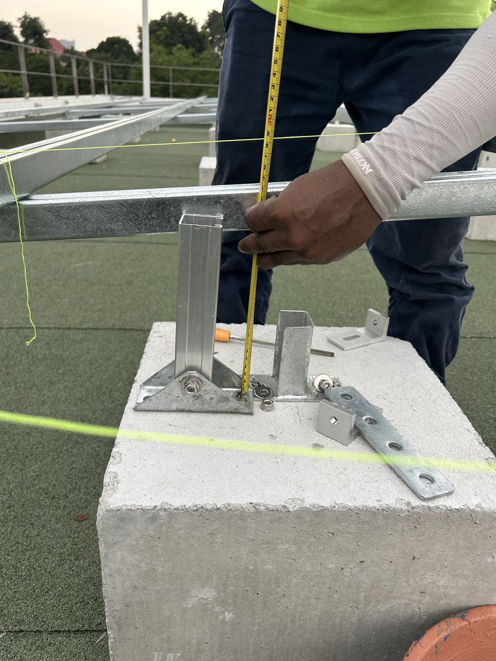 Solar mounting connection aligned above a residential flat roof
